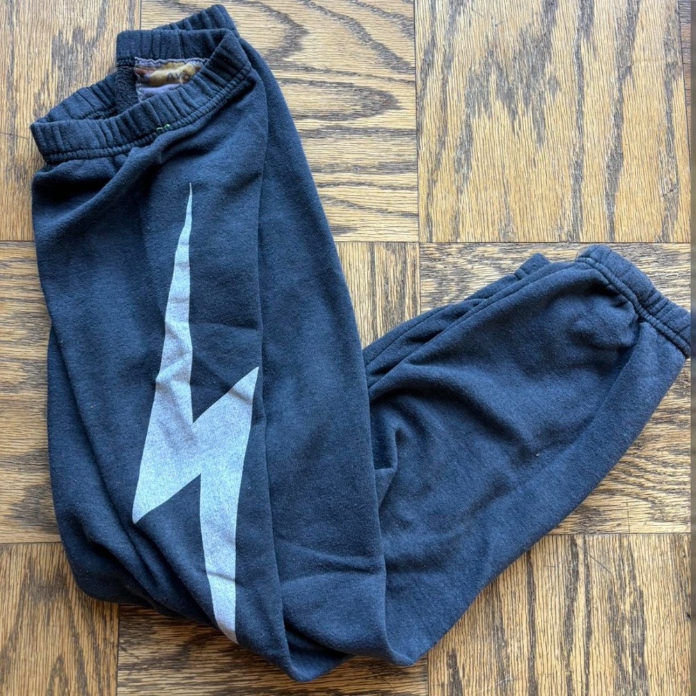 Kids size 12 black aviator nation sweatpants with lightning bolt on the side